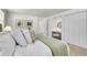 Bright main bedroom featuring a cozy nook with vanity and a spacious closet at 4781 S Grant St, Englewood, CO 80113