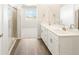 Modern bathroom features double vanity, walk-in shower, and elegant fixtures at 1927 S Coolidge Way, Aurora, CO 80018