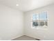 Well-lit bedroom with a window and neutral wall colors at 1927 S Coolidge Way, Aurora, CO 80018