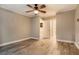 Bright bedroom featuring hardwood floors and ceiling fan at 830 N Sherman St # 106, Denver, CO 80203