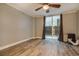 Living room with hardwood floors and sliding glass door to patio at 830 N Sherman St # 106, Denver, CO 80203