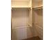 Walk-in closet featuring built-in shelving and multiple clothing rods for optimal storage at 8603 E Dry Creek Rd # 211, Englewood, CO 80112