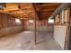 Unfinished basement featuring concrete floors and an exposed wood ceiling at 6720 W 112Th Pl, Westminster, CO 80020