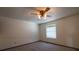 Bedroom featuring neutral carpet, ceiling fan with lights, and a bright window at 6720 W 112Th Pl, Westminster, CO 80020