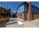 Exterior view showing the brick siding and patio area at 6720 W 112Th Pl, Westminster, CO 80020
