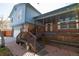 Charming home featuring a covered front porch with steps and brick accents at 6720 W 112Th Pl, Westminster, CO 80020