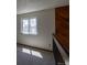 A simple hallway with a single window overlooking trees at 6720 W 112Th Pl, Westminster, CO 80020