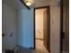 Laundry room with laminate flooring and access to the main bathroom at 6720 W 112Th Pl, Westminster, CO 80020