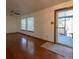 Spacious living room featuring hardwood floors and a glass door to the front porch at 6720 W 112Th Pl, Westminster, CO 80020