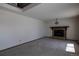 Carpeted living room with fireplace and large open floorplan at 6720 W 112Th Pl, Westminster, CO 80020