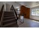 Staircase leading to the upper level featuring carpeted steps and metal railings at 6720 W 112Th Pl, Westminster, CO 80020