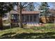 Backyard area with wooden deck and mature trees at 6720 W 112Th Pl, Westminster, CO 80020