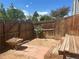 Enclosed backyard features a wooden fence and a small picnic table at 8771 Carr Loop, Arvada, CO 80005