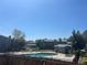 Community pool and hot tub surrounded by lush green grass at 8771 Carr Loop, Arvada, CO 80005