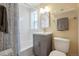 Well-lit bathroom featuring a shower-tub, modern vanity, and stylish fixtures at 2813 Jasmine St, Denver, CO 80207