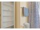 Bathroom featuring open linen closet and stylish shower-tub with decorative curtain and fixtures at 2813 Jasmine St, Denver, CO 80207