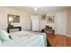 Bright bedroom showcases a comfortable bed, wood floors, and ample natural light at 2813 Jasmine St, Denver, CO 80207