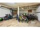 Underground bike storage room with a cement floor and multiple bicycles at 2813 Jasmine St, Denver, CO 80207