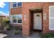 Close-up of the brick townhouse entryway, showing address numbers and a welcoming doorway at 2813 Jasmine St, Denver, CO 80207