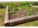 An elevated, wooden garden box with plants and the numbers 2813 at 2813 Jasmine St, Denver, CO 80207