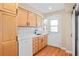 Well-lit kitchen showcases wood cabinets, marble countertops, and modern stainless steel appliances at 2813 Jasmine St, Denver, CO 80207