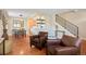 Cozy living space with a dining area, staircase, and stylish furnishings at 2813 Jasmine St, Denver, CO 80207