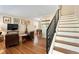 Inviting living area with hardwood floors, staircase, and comfortable seating at 2813 Jasmine St, Denver, CO 80207