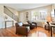Bright living space with hardwood floors, a staircase and stylish furnishings at 2813 Jasmine St, Denver, CO 80207