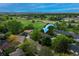 Aerial view of neighborhood with a charming home surrounded by mature trees at 117 Sandler Dr, Lafayette, CO 80026