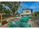 Landscaped backyard of this lovely home with mature shade trees and covered raised garden beds at 117 Sandler Dr, Lafayette, CO 80026