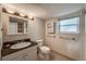 Updated bathroom featuring a vanity, toilet, and tile flooring at 117 Sandler Dr, Lafayette, CO 80026