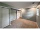 Bedroom featuring carpet, a window, and a closet at 117 Sandler Dr, Lafayette, CO 80026