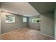 Bedroom featuring carpet and three windows with views of the outdoor green space at 117 Sandler Dr, Lafayette, CO 80026