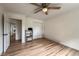 Bedroom featuring hardwood floors, ceiling fan, and a closet with mirrored sliding doors at 117 Sandler Dr, Lafayette, CO 80026