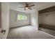 Bedroom featuring carpet, a window, a closet, and white walls at 117 Sandler Dr, Lafayette, CO 80026