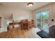 Cozy dining area with a wooden table, chairs, and sliding glass doors to the backyard at 117 Sandler Dr, Lafayette, CO 80026