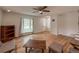 Bright living room with hardwood floors, large window, and neutral decor at 117 Sandler Dr, Lafayette, CO 80026