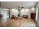 Open living room featuring hardwood floors, neutral decor, and lots of natural light at 117 Sandler Dr, Lafayette, CO 80026