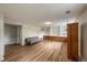 Inviting living room featuring wood floors, built-in shelving, and a comfortable sofa at 117 Sandler Dr, Lafayette, CO 80026