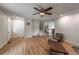 Bright living room with hardwood floors, staircase, and neutral decor at 117 Sandler Dr, Lafayette, CO 80026