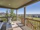 Outdoor deck area with scenic neighborhood views, comfortable seating, and stylish decor at 11096 Endeavor Dr, Parker, CO 80134