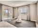 Bright exercise area with rubber flooring, a punching bag, and large windows overlooking the outdoors at 11096 Endeavor Dr, Parker, CO 80134