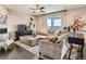 Stylish living room with comfortable sofas, a large window with a view, and modern decor at 11096 Endeavor Dr, Parker, CO 80134