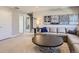 Comfortable living room featuring a plush sofa, modern decor, and soft carpet for a cozy ambiance at 11096 Endeavor Dr, Parker, CO 80134