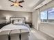 Comfortable main bedroom with tray ceiling, large window with views, and bench seating at 11096 Endeavor Dr, Parker, CO 80134