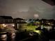 View of neighborhood featuring houses and a firework display at night at 11096 Endeavor Dr, Parker, CO 80134