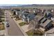 Wide aerial view of the neighborhood showcasing street, house, yard and surrounding homes at 8783 S Carr Way, Littleton, CO 80128