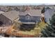 Aerial view showcasing the backyard, deck, and surrounding neighborhood at 8783 S Carr Way, Littleton, CO 80128