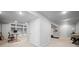 Spacious finished basement with rec area, built-ins, and neutral carpeting at 8783 S Carr Way, Littleton, CO 80128