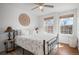 Bedroom with natural light, a comfortable bed, and stylish decor at 8783 S Carr Way, Littleton, CO 80128